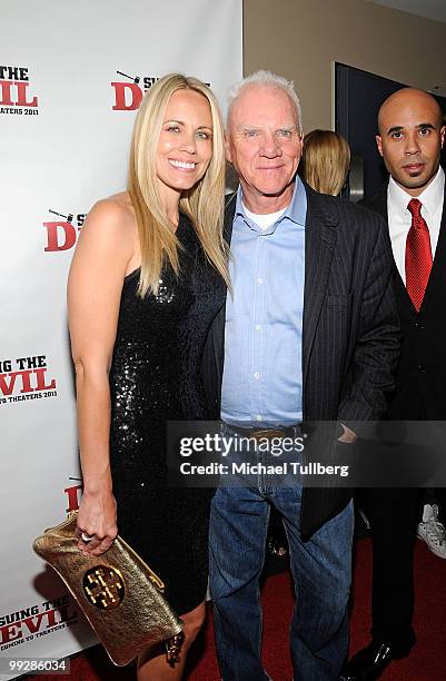 Actors Shannen Fields and Malcolm McDowell arrive at the premiere of the film "Suing The Devil" at Fox Studios Hollywood on May 13, 2010 in Los...