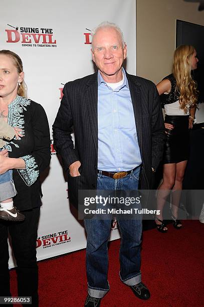 Actor Malcolm McDowell arrives at the premiere of the film "Suing The Devil" at Fox Studios Hollywood on May 13, 2010 in Los Angeles, California.