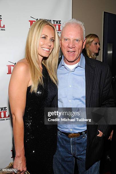 Actors Shannen Fields and Malcolm McDowell arrive at the premiere of the film "Suing The Devil" at Fox Studios Hollywood on May 13, 2010 in Los...