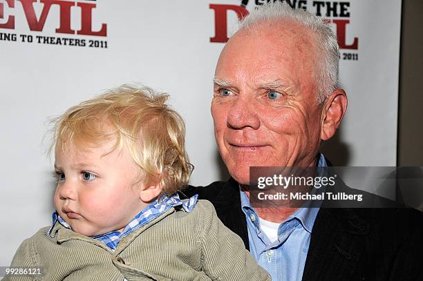 Actor Malcolm McDowell arrives with son Seamus at the premiere of the film "Suing The Devil" at Fox Studios Hollywood on May 13, 2010 in Los Angeles,...