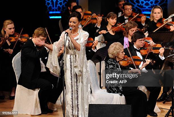 Moroccan singer Karima Skalli performs with the Multi Ethnic Star Orchestra at the "Angham min al-Sharq" festival in Abu Dhabi late on May 13, 2010....