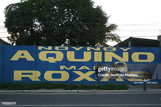 Commuter is seen waiting for a ride in the hometown of Benigno "Noynoy" Aquino on May 14, 2010. The country went to the polls on May 10 to elect the...