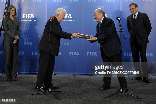 President Sepp Blatter receives from the hands of Football Federation Australia chairman Frank Lowy the bid books for 2018 and 2022 FIFA World Cups...