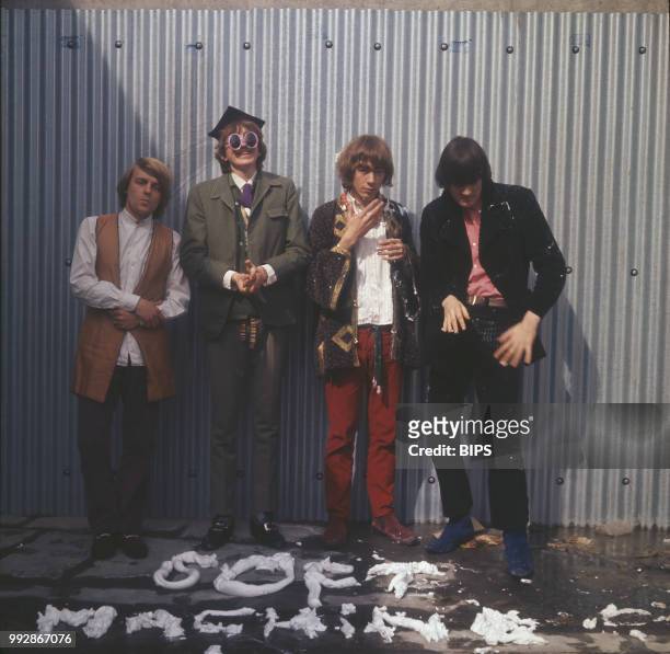 English rock and jazz band The Soft Machine in front of a whipped cream written of their band's name, UK, January 1967; they are Robert Wyatt, Daevid...