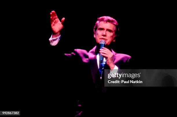 Comedian and television host Regis Philbin performs on stage at the Riverside Theater in Milwaukee, Wisconsin, March 19, 1994.