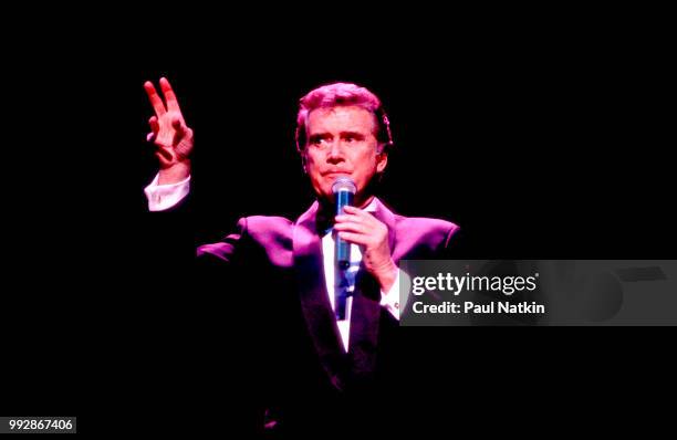 Comedian and television host Regis Philbin performs on stage at the Riverside Theater in Milwaukee, Wisconsin, March 19, 1994.