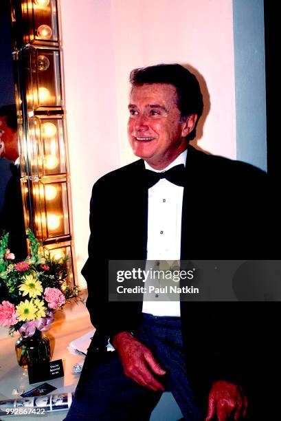 Comedian and television host Regis Philbin sits backstage at the Riverside Theater in Milwaukee, Wisconsin, March 19, 1994.