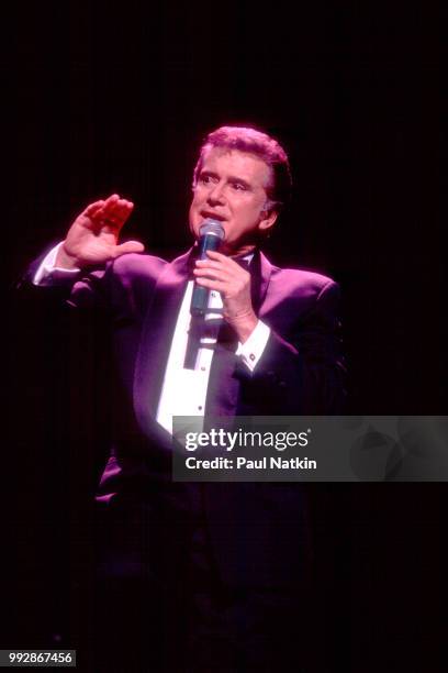 Comedian and television host Regis Philbin performs on stage at the Riverside Theater in Milwaukee, Wisconsin, March 19, 1994.