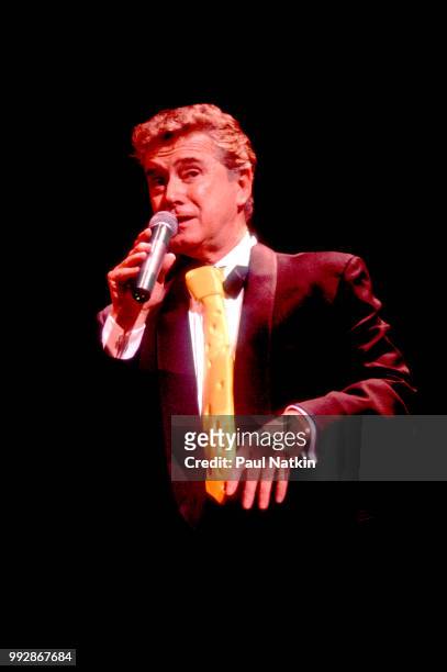 Comedian and television host Regis Philbin performs on stage at the Riverside Theater in Milwaukee, Wisconsin, March 19, 1994.