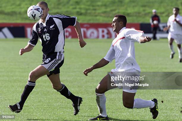 Vaughan Coveny of New Zealand battles with Heimana Paama of Tahiti during the Group 2 Oceania Qualifying Competition for the FIFA 2002 World Cup at...
