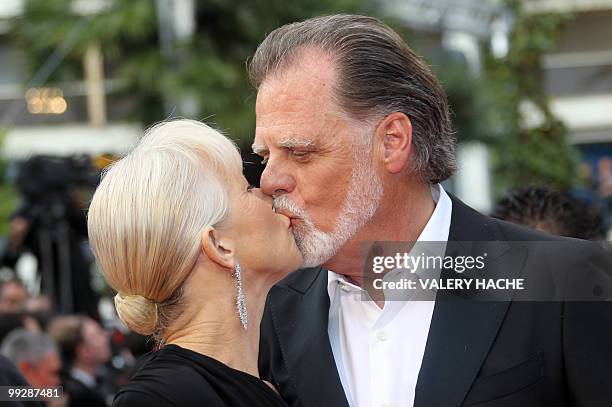 British actress Helen Mirren kisses her husband Taylor Hackford as they arrive for the opening ceremony and screening of "Robin Hood" presented out...