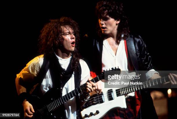 John Taylor, left, and Andy Taylor of Power Station perform on stage at the Poplar Creek Music Theater in Hoffman Estates, Illinois, August 13, 1985.