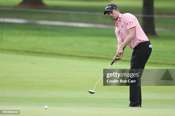 Webb Simpson putts on the 11th hole during round two of A Military Tribute At The Greenbrier at the Old White TPC course on July 6, 2018 in White...