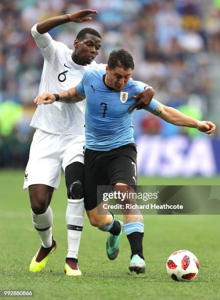 Paul Pogba of France battles for possession with Cristian Rodriguez of Uruguay during the 2018 FIFA World Cup Russia Quarter Final match between...