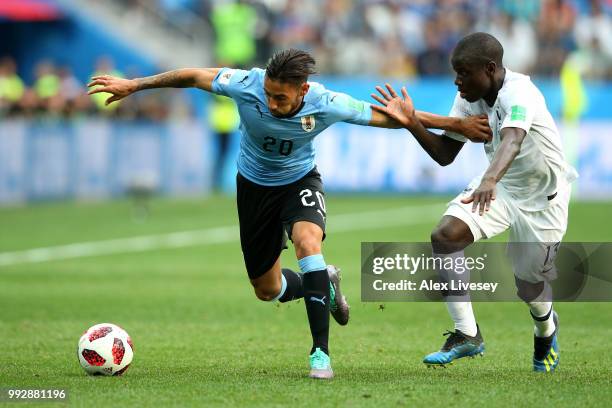 Jonathan Urretaviscaya of Uruguay battles for possession with Ngolo Kante of France during the 2018 FIFA World Cup Russia Quarter Final match between...