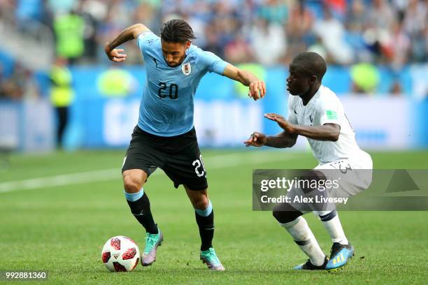 Jonathan Urretaviscaya of Uruguay is challenged by Ngolo Kante of France during the 2018 FIFA World Cup Russia Quarter Final match between Uruguay...