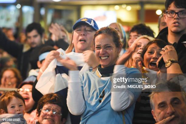 Fans of Uruguay attend the broadcasting of the Russia 2018 FIFA World Cup football match Uruguay against France on a big screen at the Mercado...