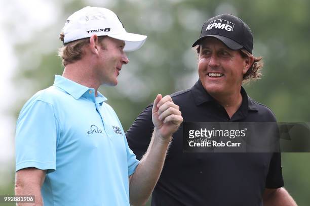 Brandt Snedeker and Phil Mickelson talk on the 12th tee box during round two of A Military Tribute At The Greenbrier held at the Old White TPC course...