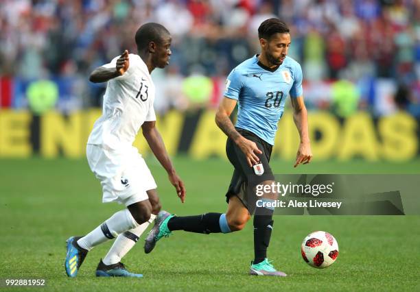 Jonathan Urretaviscaya of Uruguay is challenged by Ngolo Kante of France during the 2018 FIFA World Cup Russia Quarter Final match between Uruguay...