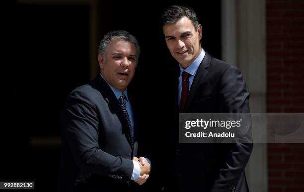 Spanish Prime Minister Pedro Sanchez welcomes Colombian President Ivan Duque prior to their meeting at Palace of Moncloa, official residence for the...