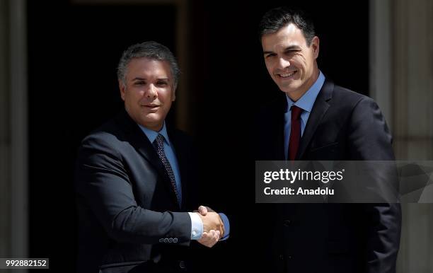 Spanish Prime Minister Pedro Sanchez welcomes Colombian President Ivan Duque prior to their meeting at Palace of Moncloa, official residence for the...