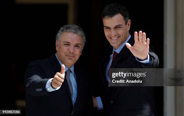 Spanish Prime Minister Pedro Sanchez welcomes Colombian President Ivan Duque prior to their meeting at Palace of Moncloa, official residence for the...