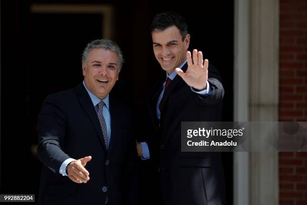 Spanish Prime Minister Pedro Sanchez welcomes Colombian President Ivan Duque prior to their meeting at Palace of Moncloa, official residence for the...