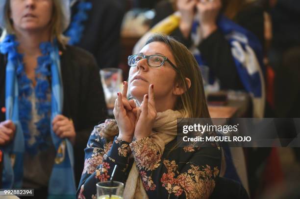 Fans of Uruguay attend the broadcasting of the Russia 2018 FIFA World Cup football match, Uruguay against France, at a bar in downtown Montevideo, on...