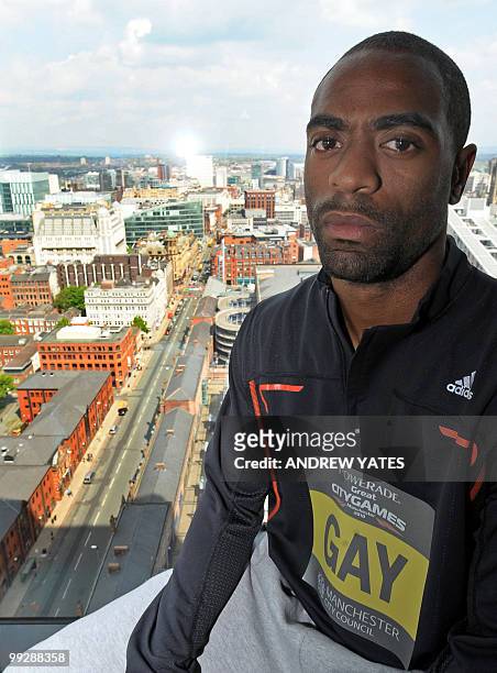 Sprinter Tyson Gay poses for photographers during a photocall ahead of the 'Great CityGames Manchester', at a hotel in Manchester on May 13, 2010....