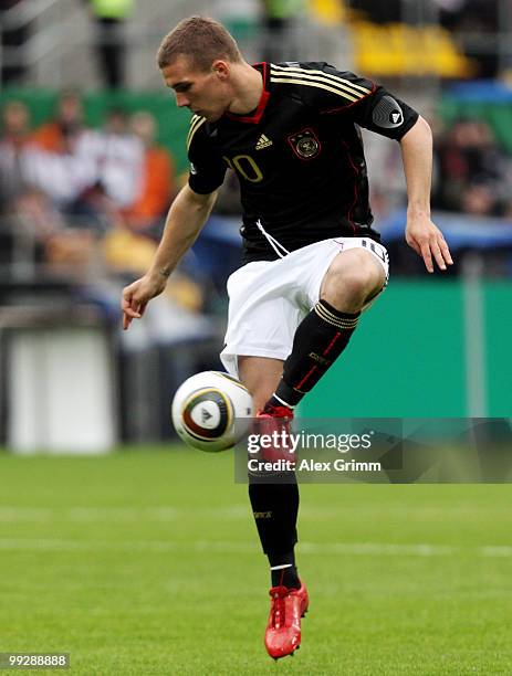 Lukas Podolski of Germany controles the ball during the international friendly match between Germany and Malta at Tivoli stadium on May 13, 2010 in...