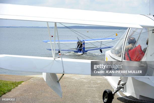 Seaplanes line up for take off at the Lac de Biscarosse during the international Biscarosse seaplane rally on May 13, 2010 in southwestern France....