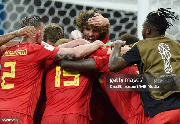 Marouane Fellaini and Belgian players celebrate after scoring a goal and winning the 2018 FIFA World Cup Russia Round of 16 match between Belgium and...