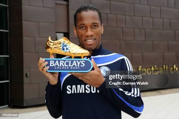 Didier Drogba of Chelsea poses with the Barclays Golden Boot award after a training session at the Cobham Training ground on May 13, 2010 in Cobham,...