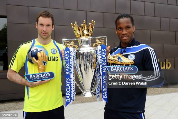 Didier Drogba of Chelsea pose with the Barclays Golden Boot award and Petr Cech with the Barclays Golden Glove award after a training session at the...