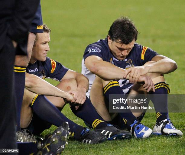 Matt Giteau of the Brumbies and team mate Adam Ashley-Cooper look dejected after the round 14 defeat in the Super 14 match between the Crusaders and...