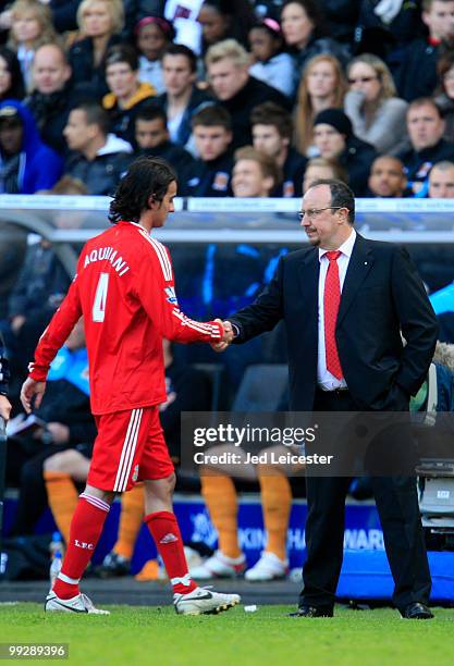 Alberto Aquilani of Liverpool shakes hands with manager Rafael Benitez as he is substituted during the Barclays Premier League match between Hull...