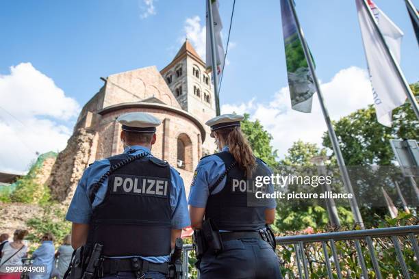 July 2018, Bad Hersfeld, Germany: Visitors stand in front of the diocese remains before the start of the opening of the 68th Bad Hersfeld festival,...