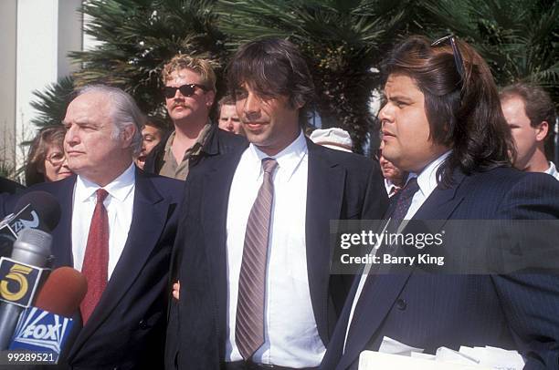Marlon Brando, with sons Christian and Meeko Brando, at the trial for his son Christian Brando at Santa Monica Courthouse in Santa Monica, California...