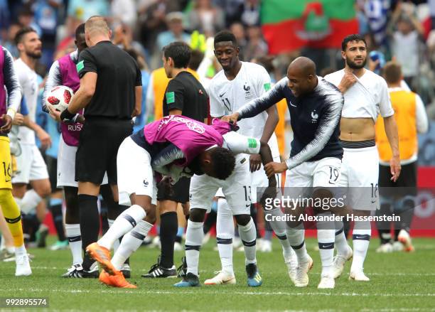 Ngolo Kante, Thomas Lemar and Djibril Sidibe of France celebrate victory following the 2018 FIFA World Cup Russia Quarter Final match between Uruguay...