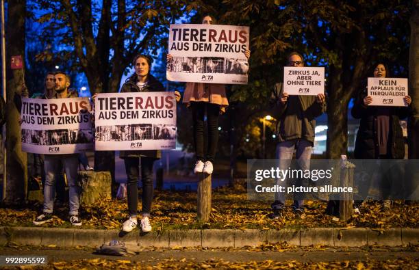 Animal rights activists protesting against the use of animals in circus shows ahead of the show by the Krone Circus at the Cannstatter Wasen festival...