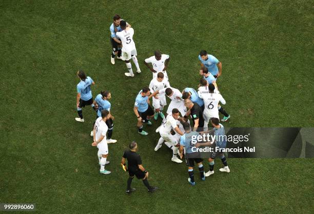 Uruguay and France players clash during the 2018 FIFA World Cup Russia Quarter Final match between Uruguay and France at Nizhny Novgorod Stadium on...
