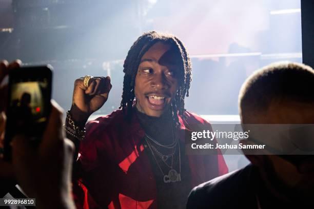 Wiz Khalifa performs on stage after the HUGO show during the Berlin Fashion Week Spring/Summer 2019 at Motorwerk on July 5, 2018 in Berlin, Germany.