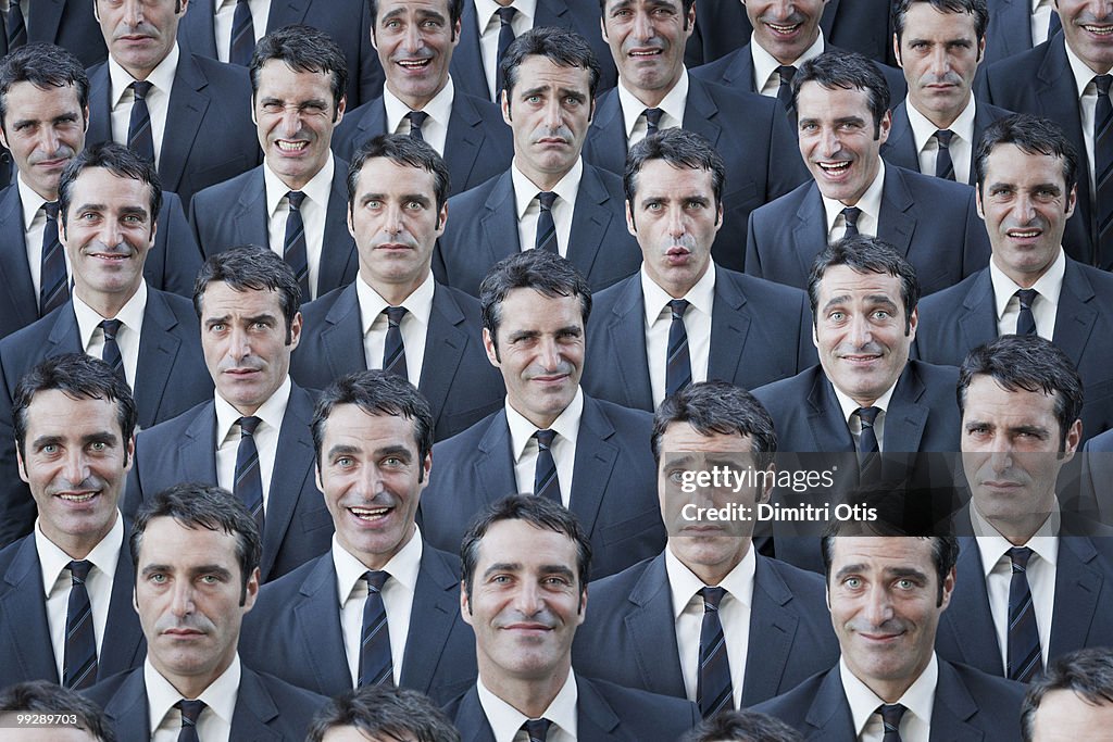 Crowd of businessmen with multiple expressions