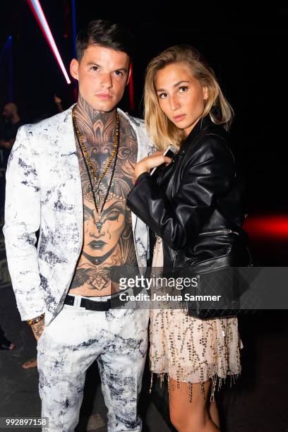 Tommy Hey and guest attend the HUGO show during the Berlin Fashion Week Spring/Summer 2019 at Motorwerk on July 5, 2018 in Berlin, Germany.