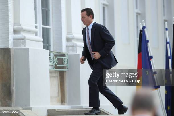 Ambassador Richard Grenell departs after attending a reception for the internaitonal diplomatic corps hosted by German Chancellor Angela Merkel at...