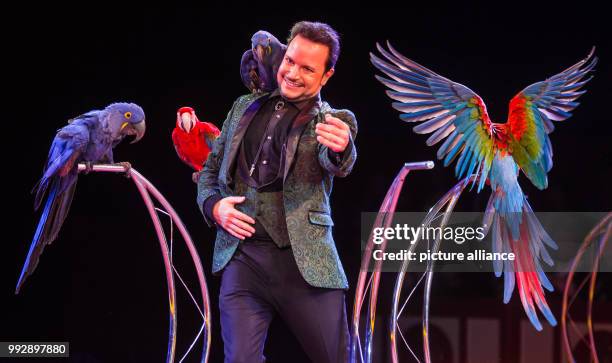Artist Alessio presents the parrot show during the premiere of the Circus Krone at the Cannstatter Wasen in Stuttgart, Germany, 26 October 2017. The...