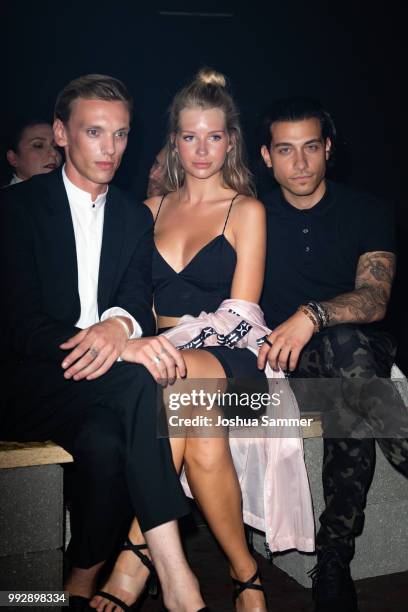 Jamie Campbell Bower, Lottie Moss and Rob Raco attend the HUGO show during the Berlin Fashion Week Spring/Summer 2019 at Motorwerk on July 5, 2018 in...