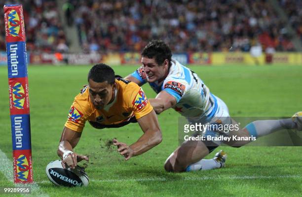 Israel Folau of the Broncos scores a try during the round 10 NRL match between the Brisbane Broncos and the Gold Coast Titans at Suncorp Stadium on...