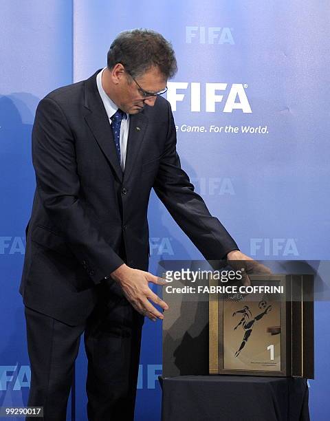 Secretary General Jerome Valcke displays the Korean World Cup bid books during an official handover ceremony at FIFA's headquarters on May 14, 2010...