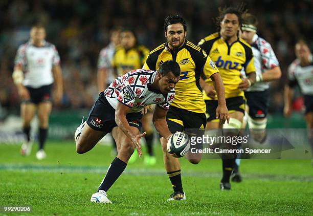 Kurtley Beale of the Waratahs regathers the ball during the round 14 Super 14 match between the Waratahs and the Hurricanes at Sydney Football...
